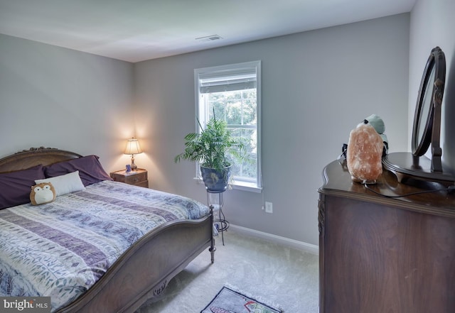 bedroom with light carpet