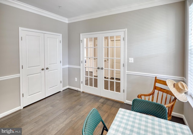 living area featuring crown molding, french doors, and wood-type flooring