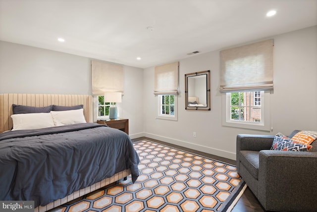 bedroom with hardwood / wood-style floors