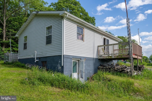 view of side of property with a deck