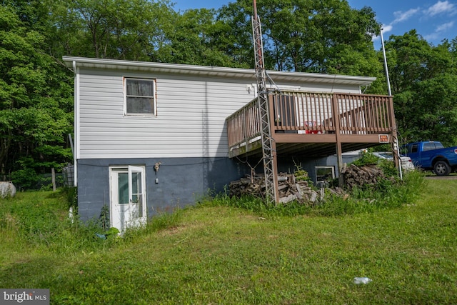 back of house featuring a wooden deck