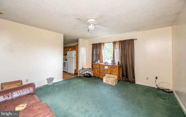 unfurnished living room with carpet flooring, ceiling fan, and a textured ceiling