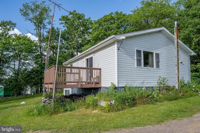 view of side of property with a deck