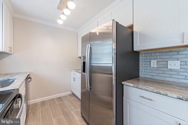 kitchen featuring white cabinets, decorative backsplash, light stone countertops, and appliances with stainless steel finishes