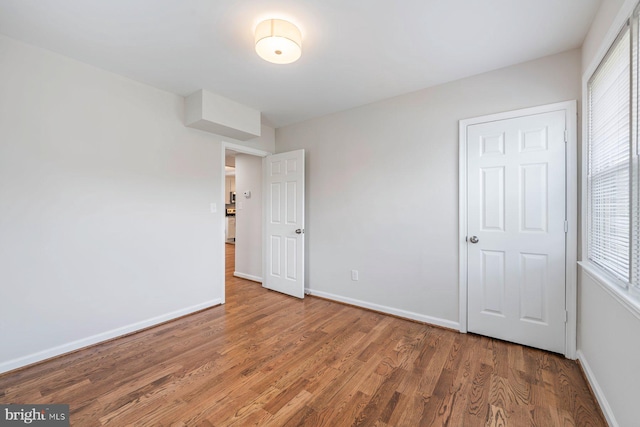 unfurnished bedroom featuring wood-type flooring