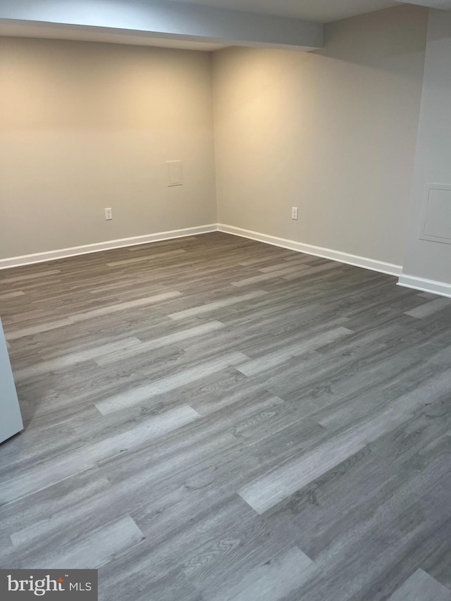 unfurnished room with hardwood / wood-style flooring