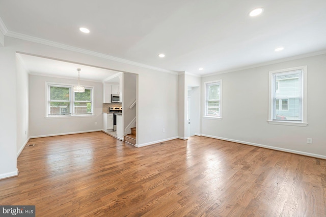 unfurnished living room with crown molding and wood-type flooring