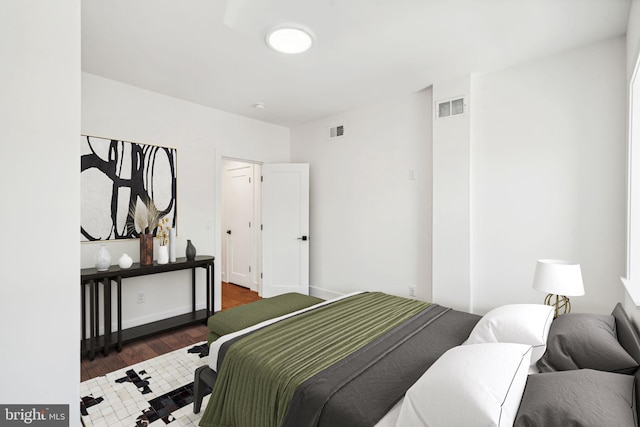 bedroom featuring dark hardwood / wood-style flooring