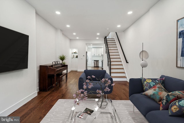 living room with dark hardwood / wood-style floors