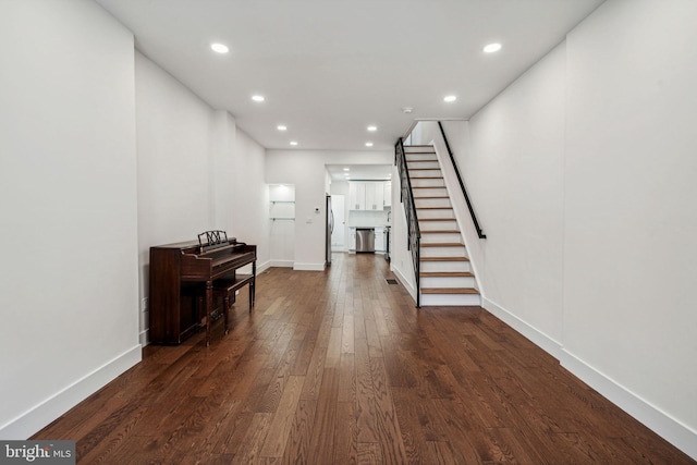 hall with dark hardwood / wood-style floors