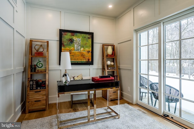 home office with hardwood / wood-style flooring