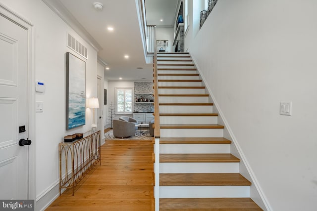 stairway with wood-type flooring