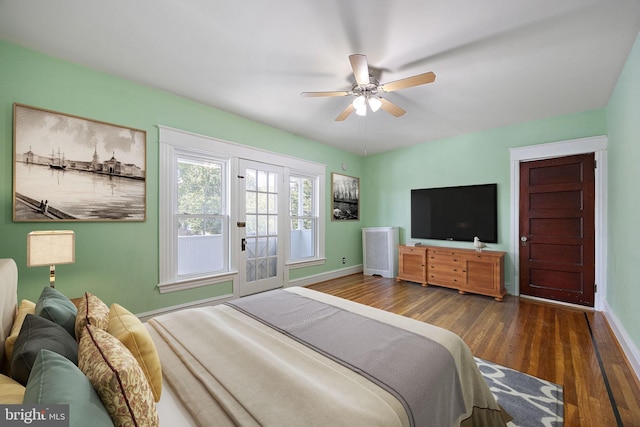 bedroom featuring ceiling fan and dark wood-type flooring