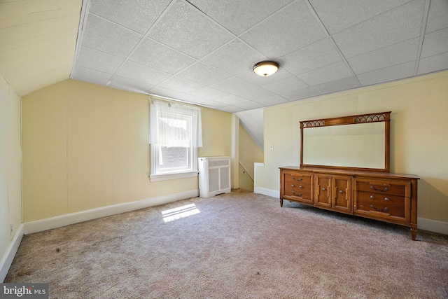 bonus room with light carpet and lofted ceiling