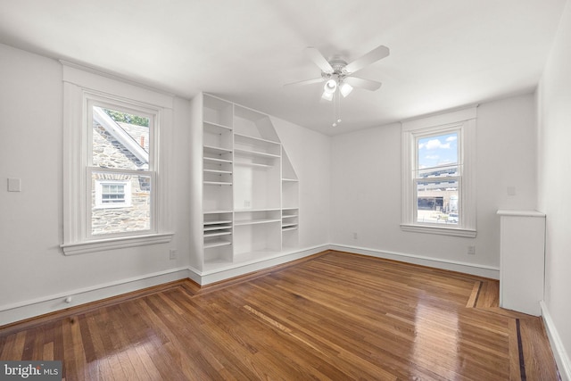 unfurnished room featuring ceiling fan and hardwood / wood-style flooring