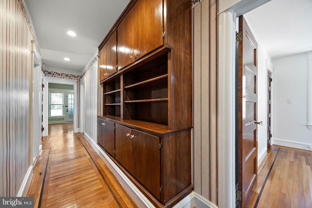 hallway with light hardwood / wood-style flooring