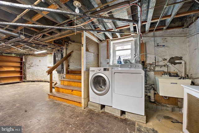 laundry area with washer and dryer and sink