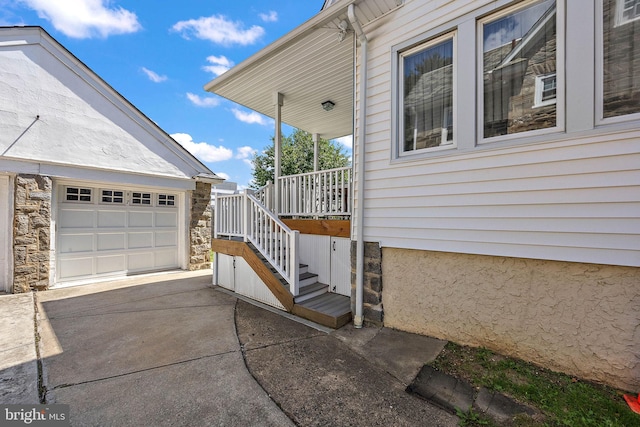 view of exterior entry featuring a garage