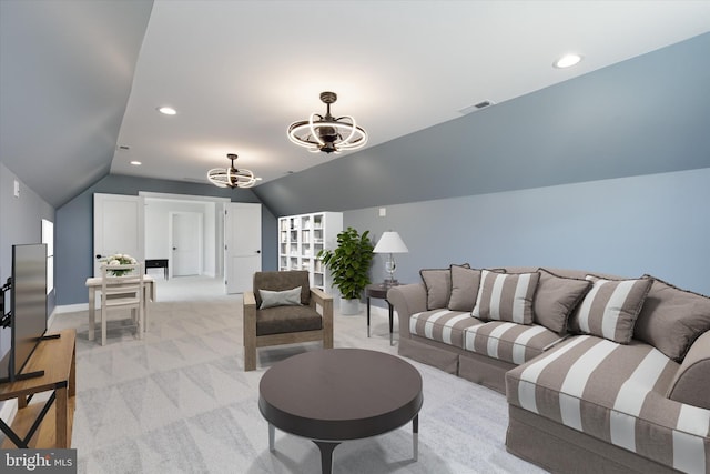 carpeted living room featuring vaulted ceiling and an inviting chandelier