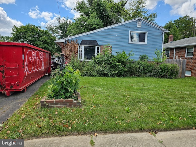 view of home's exterior with a lawn