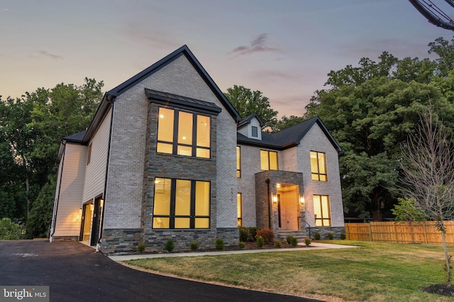 view of front of home featuring a yard