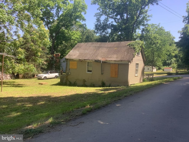 view of home's exterior with a lawn