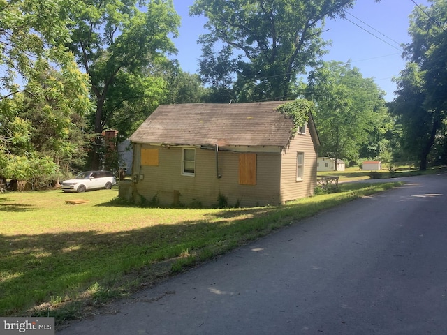 view of property exterior featuring a yard