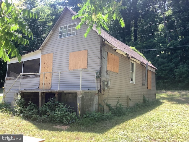 view of home's exterior featuring a lawn