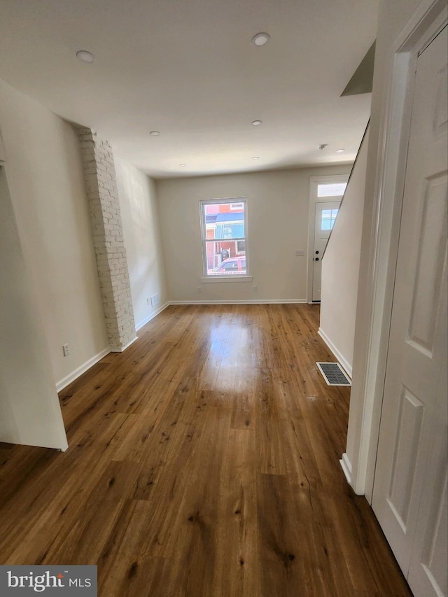 spare room with hardwood / wood-style floors