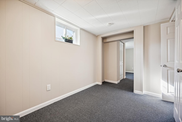 interior space featuring dark carpet