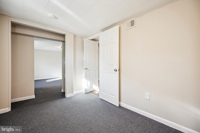 interior space featuring dark carpet