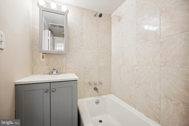 bathroom with vanity and a tub to relax in