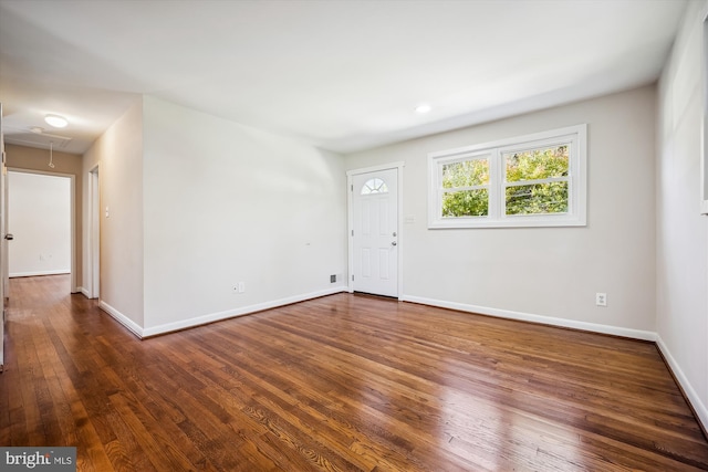 spare room featuring dark wood-type flooring