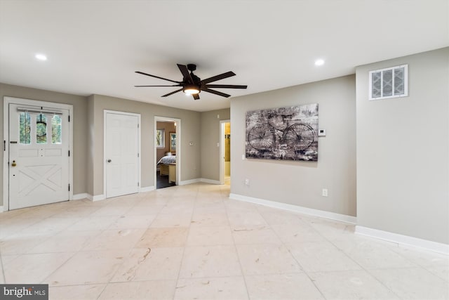 foyer with recessed lighting, visible vents, baseboards, and ceiling fan