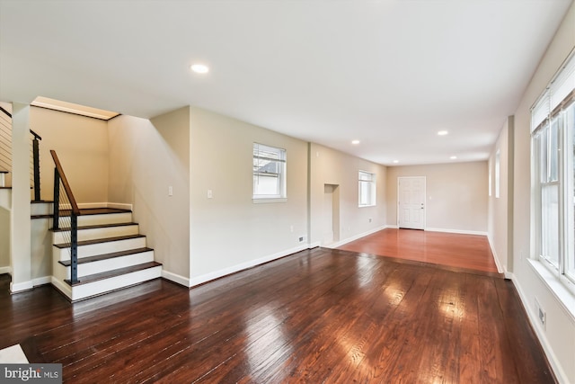 interior space featuring recessed lighting, stairs, baseboards, and hardwood / wood-style flooring