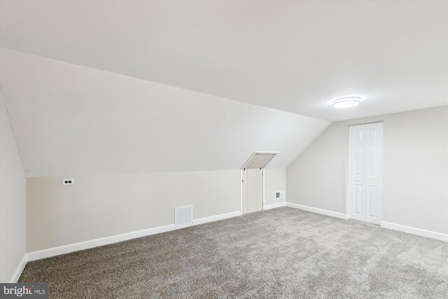 bonus room featuring carpet flooring, baseboards, vaulted ceiling, and visible vents