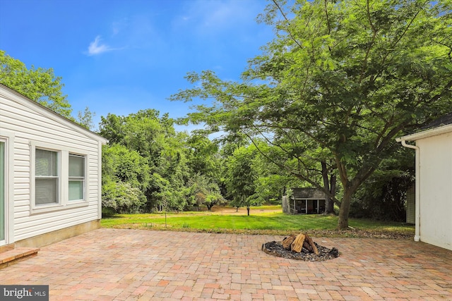 view of patio / terrace with an outbuilding