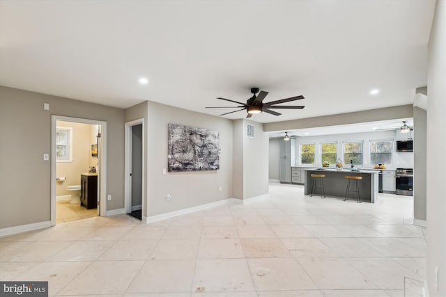 unfurnished living room with recessed lighting, visible vents, baseboards, and a ceiling fan