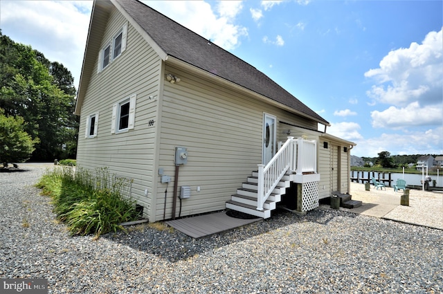 view of side of home featuring a water view