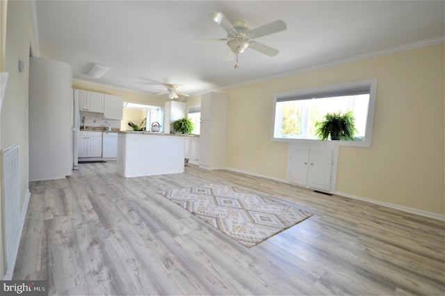 unfurnished living room with crown molding, ceiling fan, and light hardwood / wood-style floors