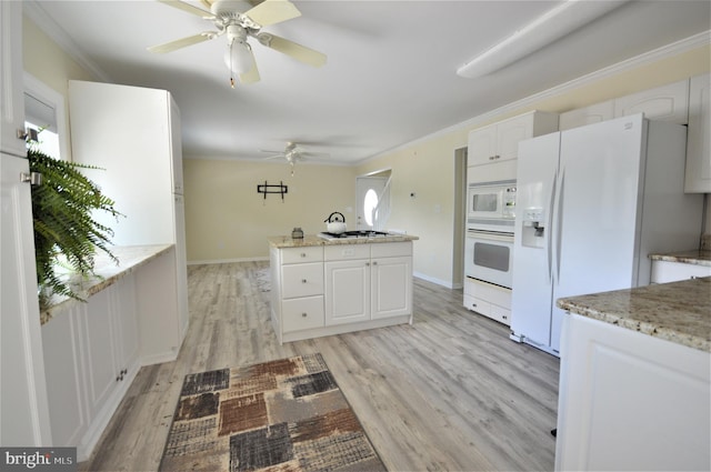 kitchen with crown molding, white appliances, light hardwood / wood-style flooring, light stone countertops, and white cabinets