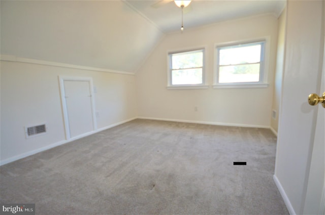 bonus room featuring vaulted ceiling, light colored carpet, and ceiling fan