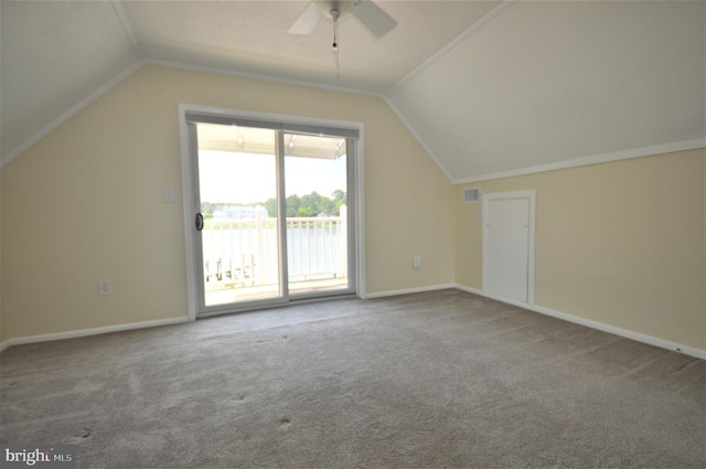 additional living space featuring ceiling fan, carpet floors, and vaulted ceiling