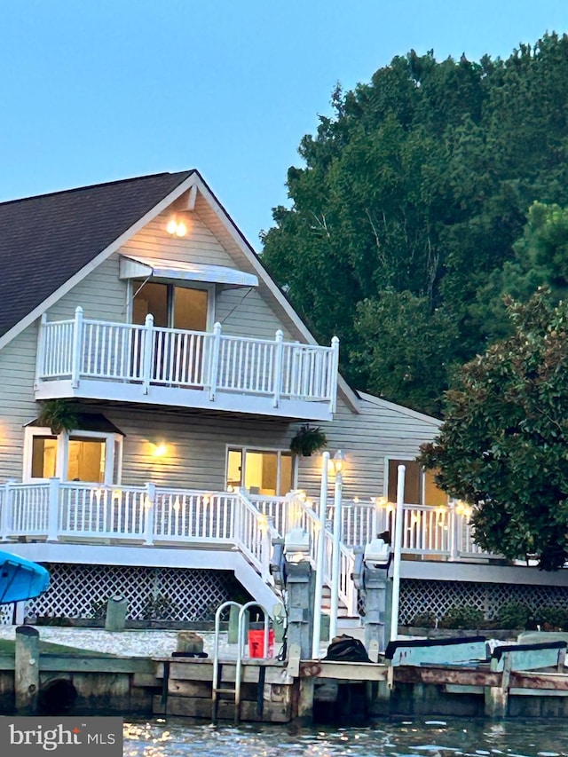 rear view of property with a balcony