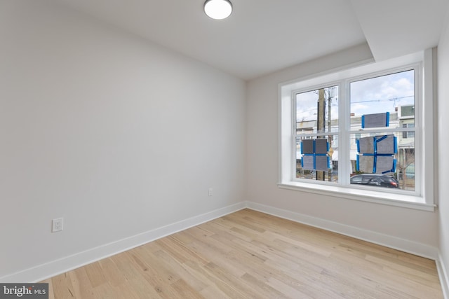 unfurnished room featuring light hardwood / wood-style flooring