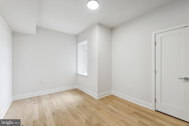 empty room with light hardwood / wood-style floors