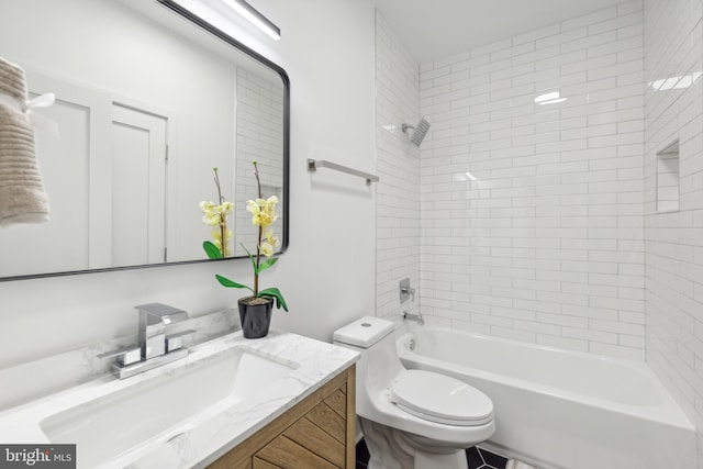 full bathroom with tiled shower / bath combo, toilet, and vanity