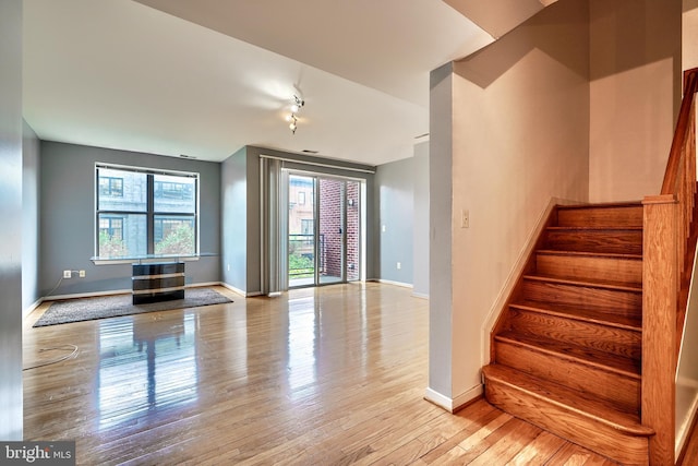 staircase featuring hardwood / wood-style floors