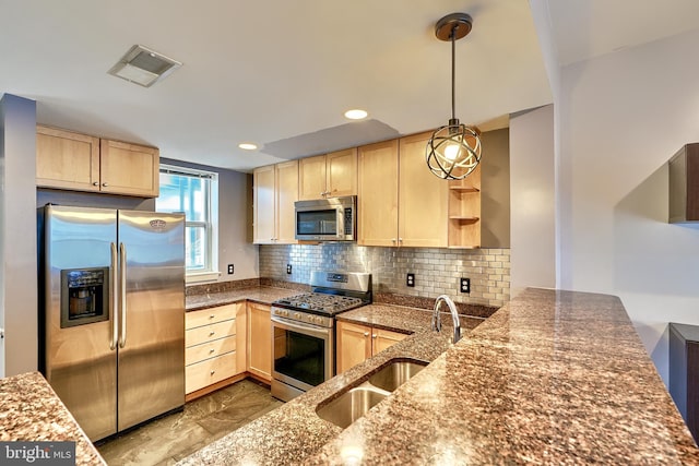 kitchen featuring light brown cabinetry, sink, appliances with stainless steel finishes, and kitchen peninsula