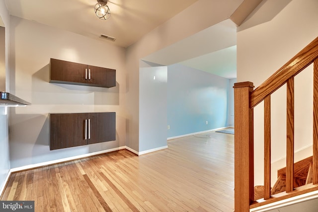 unfurnished living room featuring light wood-type flooring